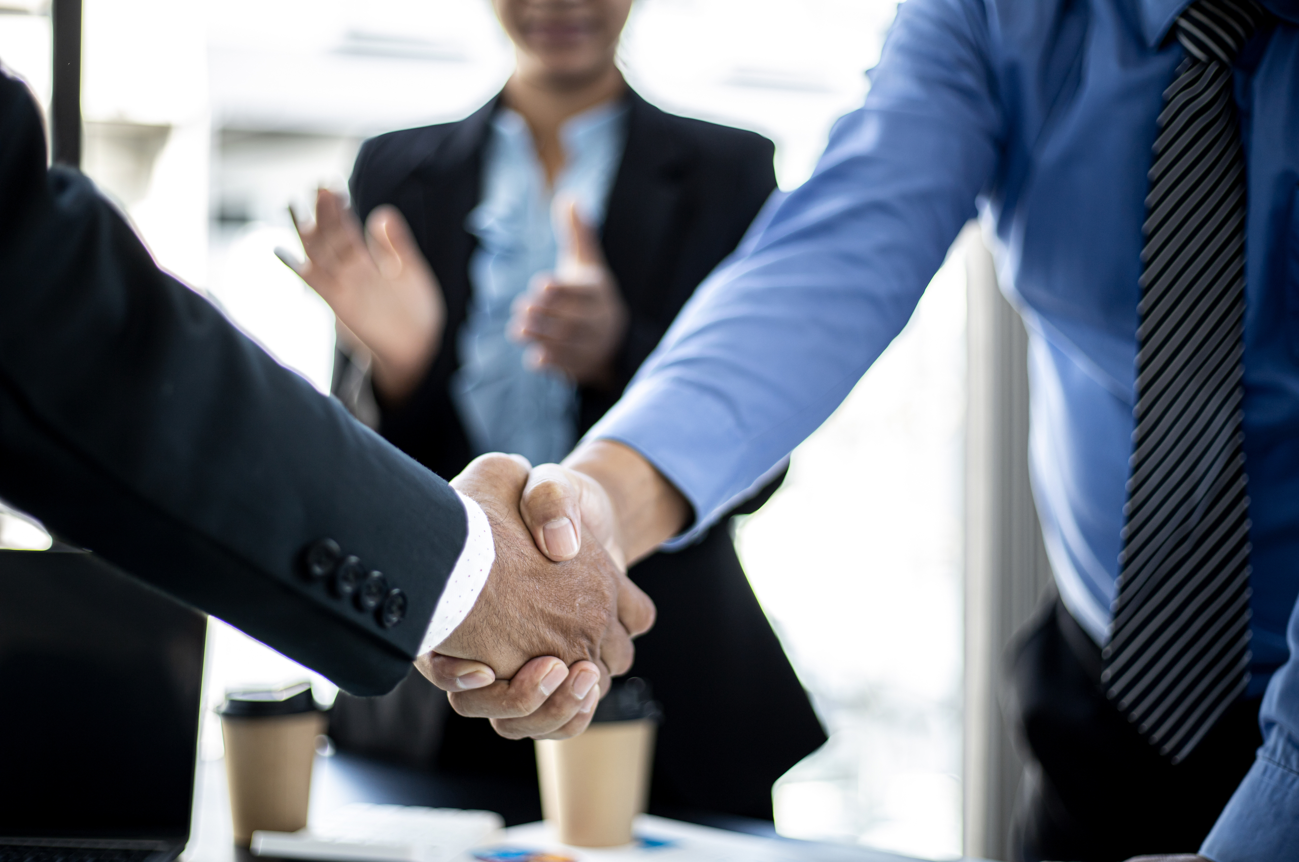 close-up of two businesspeople shaking hands