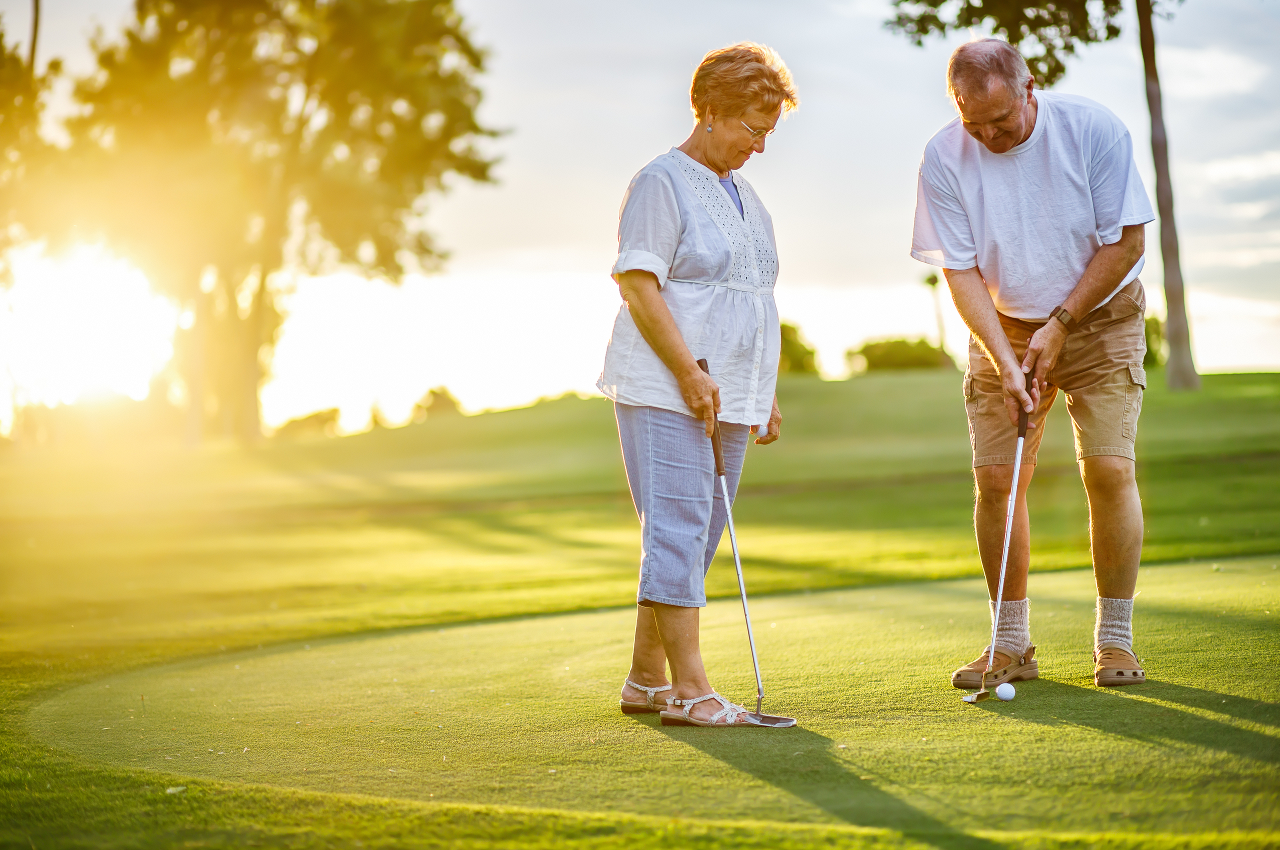 older couple putting on a golf green